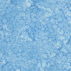 This batik cotton fabric features tonal (reads as a solid) light blue bubbles.