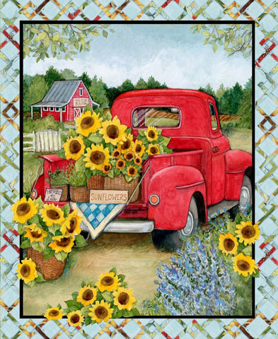 This fabric quilt panel features a vintage red pickup truck filled with baskets full of sunflowers and a red barn in the background