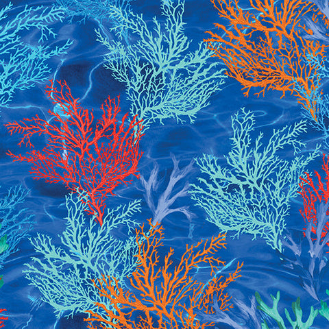 This cotton fabric featuring coral in oranges and blues on a rich blue background