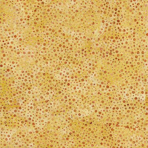 This batik cotton fabric features brown dots on tan. Available at Colorado Creations Quilting