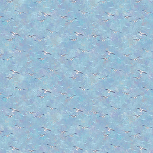 This printed cotton has beautiful seagulls on a illuminating background in blues.