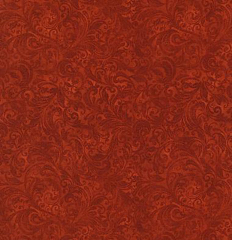 This tonal (reads as a solid) fabric features rich rust colored filigree scroll designs