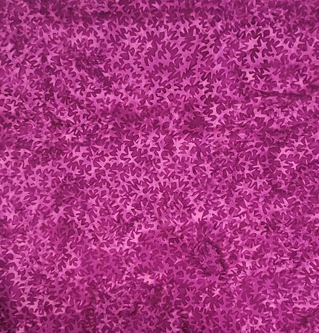 This violet purple tonal fabric features geometric spike shapes by Island Batiks. Available at Colorado Creations Quilting