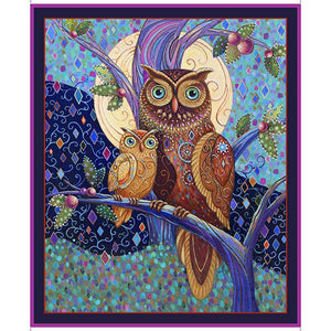 This fabric quilt panel features a pair of owls resting on a tree branch.