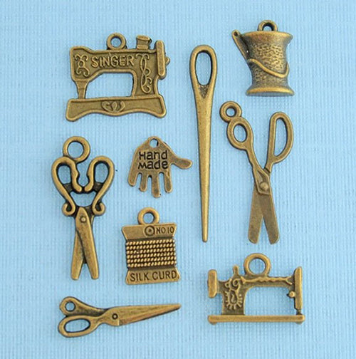 These charming approximately 1/2" bronze-toned charms featuring sewing related items like scissors, needles, sewing machines and more