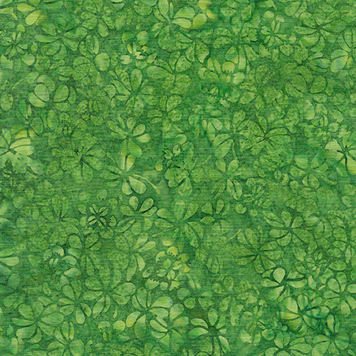 This batik cotton fabric features images of clovers in shades of greens. Available at Colorado Creations Quilting