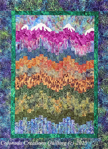The Mountain Bargello quilt pattern a mountain scene complete with snow-covered mountains, wildlife and forest trees using the bargello quilt technique.