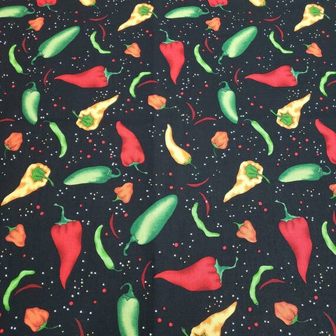 This fun cotton fabric features chili peppers in red, green, orange and yellow 