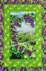 The panel quilt kit features a peaceful vineyard scene with rows of grape vines, the wine country home and surrounded by grapes. The inner border is a lattice to finish off the vineyard theme. Additionally all the coordinating fabric in shades of green and purple grapes.