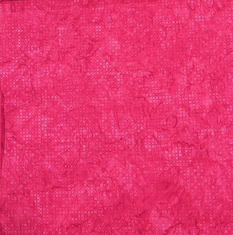 The bright pink tonal batik fabric with small x's. Available at Colorado Creations Quilting