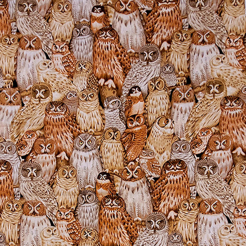 This cotton fabric features owls in shades of brown. 