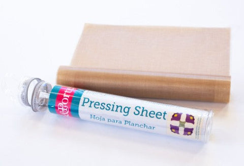 A tubular package with product info and the tan pressing sheet are featured