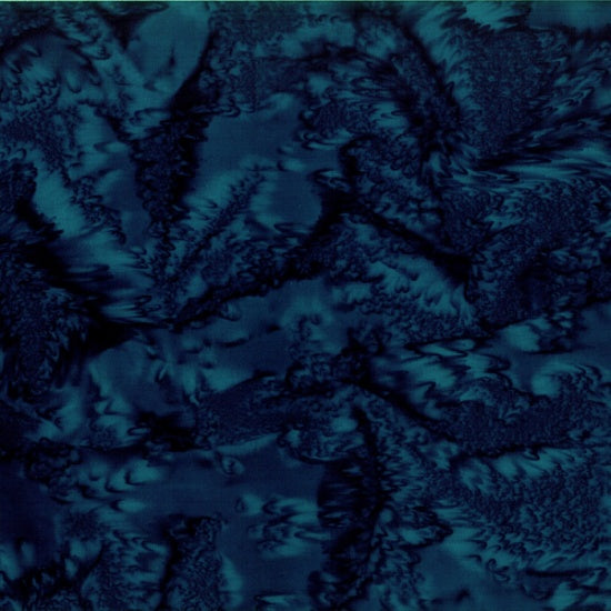 This batik cotton fabric features a dark navy blue color.