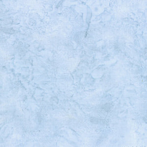 This batik cotton fabric features a light blue with gray toned color.