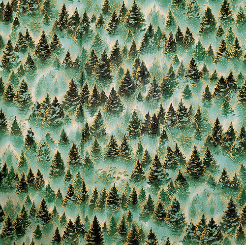 This fabric features stacked evergreen trees in shades of  green with a bit of metallic gold. Available at Colorado Creations Quilting