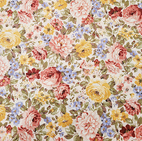 This cotton fabric features soft flowers like roses and more in pastel pinks, yellows and blues on a cream background. 