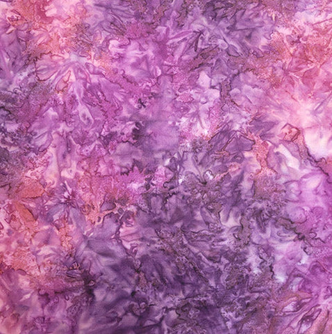 This rich batik cotton fabric moves from purple to violet and finally red 