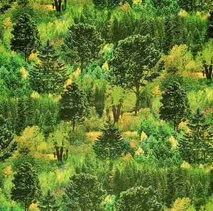 This digitally printed cotton fabric features a variety of packed green trees.