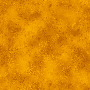 This cotton fabric features golden amber texture.