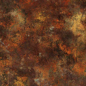 This cotton fabric features deep browns and rusts texture.