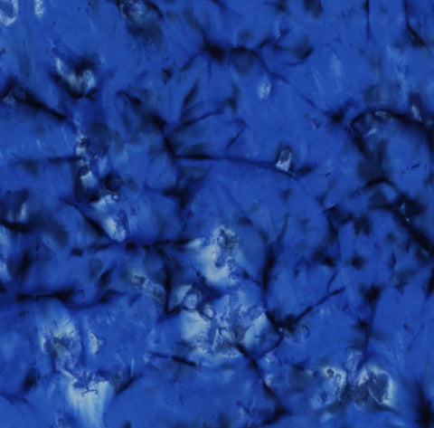 This dark blue batik looks like the inside of a geode rock formation.