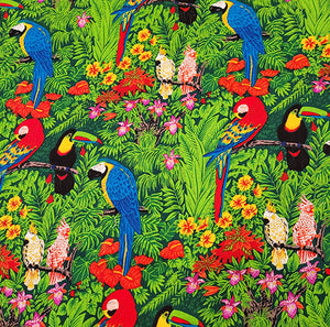 Fabric features exotic birds like toucan, cockatoo and macaw among tropical leaves.