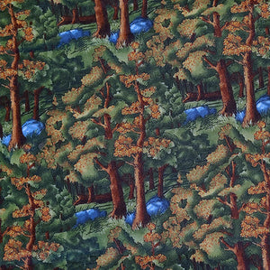 This fabric features  a forest of trees in shades of green and brown. Available at Colorado Creations Quilting