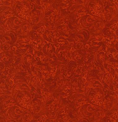 This tonal (reads as a solid) fabric features rich rust colored filigree scroll designs