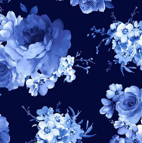 This cotton fabric features large blue flower clusters on a navy blue background. 