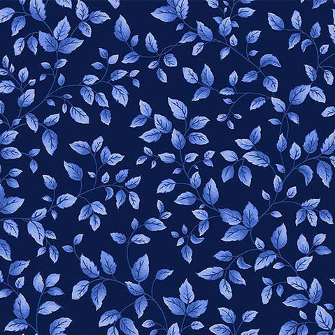 This cotton fabric features small blue leaves tossed on a navy blue background.