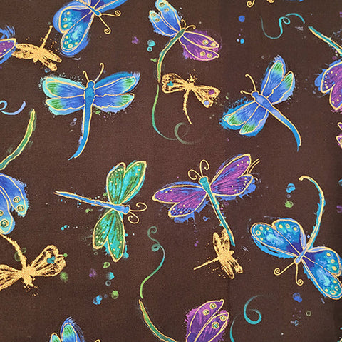 This fabric features dragonflies in blues and purples outlined in metallic gold on a black background.