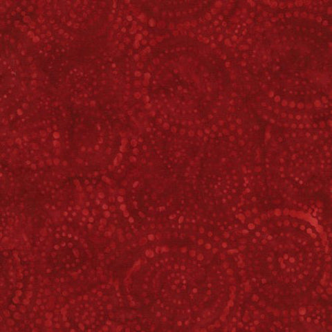 This fabric features a tonal swirling red dots on red batik.  