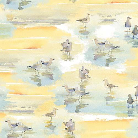This cotton fabric features watercolored sand pipers on a rich blue background. Available at Colorado Creations Quilting