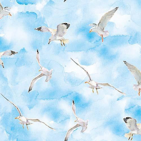 This cotton fabric features watercolored seagulls on a rich blue background. Available at Colorado Creations Quilting