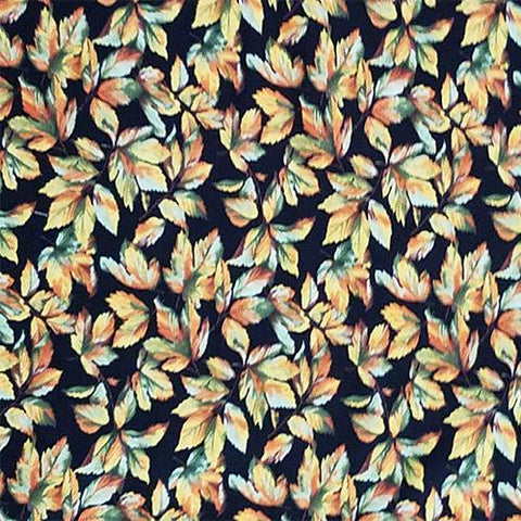 Fall Leaves of green, orange, and yellow on a black background cotton fabric available at Colorado Creations Quilting