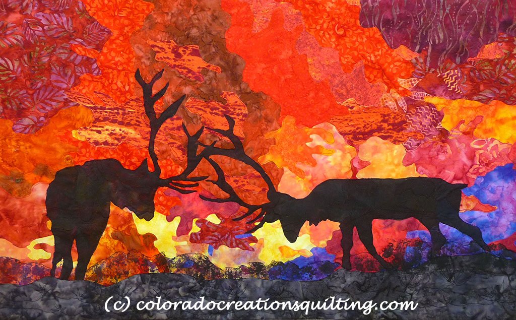 A silhouette of majestic elk as they clash antlers with a beautiful sunset in the background.  Quilt pattern available at Colorado Creations Quilting