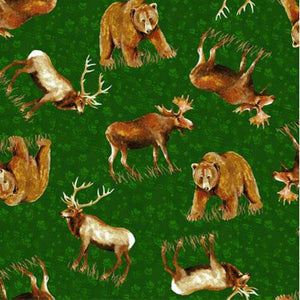 This fabric features elk, moose, and bear on a green background with paw prints.  Cotton Fabric available at Colorado Creations Quilting