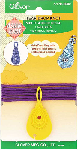 A plastic template to help you make tear drop knots out of cording.