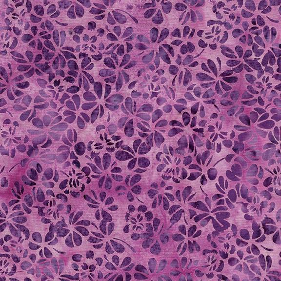 This violet/purple tonal fabric features images of clover batik fabric by Island Batiks. Available at Colorado Creations Quilting