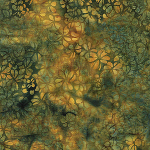 This batik cotton fabric features images of clovers in shades of greens and golds. Available at Colorado Creations Quilting