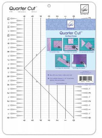 A large clear acrylic ruler with grooves for cutting at each 1/2" mark