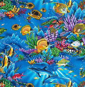 This cotton fabric features tropical fish, coral, dolphins and more in a blue ocean. Available at Colorado Creations Quilting