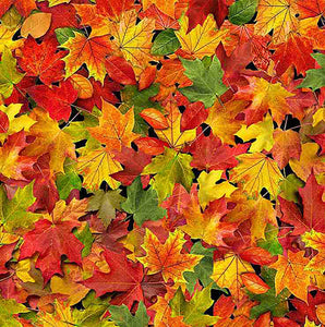 This cotton fabric features autumn maple leaves in red, gold, rust, green