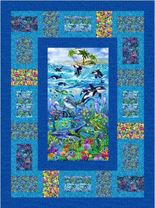 The Reef quilt pattern by Jackie Vujcich is a tribute to life under the sea. Start with a wonderful fabric panel by Timeless Treasures and add in coral, sea turtles, sea horses, killer whales, tropical fish and more. Panel and coordinateing blocks are surrounded by blue borders.