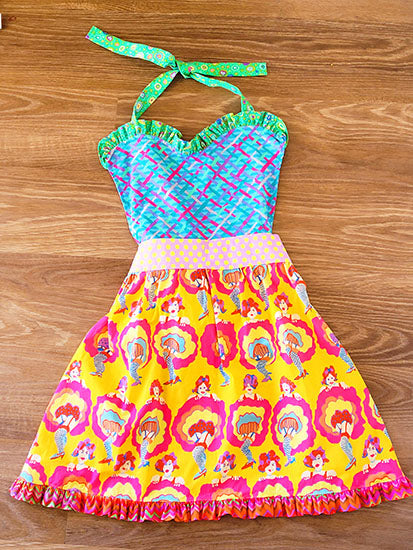 These handmade aprons are a fun addition whether it's for every day use, holidays or special occasion. This one-of-a-kind apron with can can girls images  in brightly colored Kaffe Fasset are made from 100% cotton fabric.
