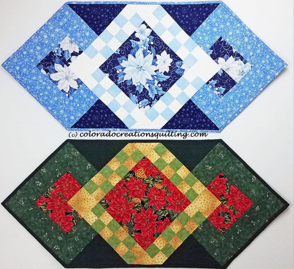 Blue Christmas quilt table runner has blue pointsettias in the center square with blue and white checker board surrounding it along with a few more borders available at Colorado Creations Quilting