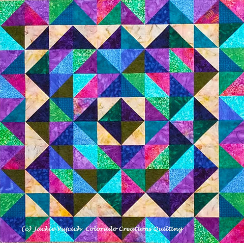 At a Crossroads quilt in blue-purple green colorway using triangles available at Colorado Creations Quilting