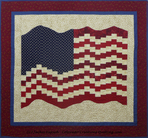 Bargello (USA) Flag on a background of cream with blue and red surrounding borders by Colorado Creations Quilting