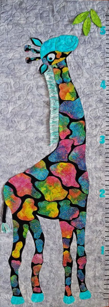 This adorable five-foot brightly spotted giraffe in pinks, blues and yellows on a background of gray in the form of a grow chart is the subject of this quilt pattern, Stand Tall, by Jackie Vujcich of Colorado Creations Quilting.