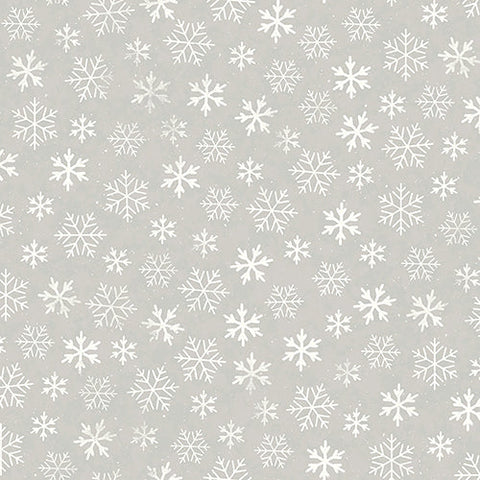 This cotton fabric features white snowflakes on a light gray background. Available at Colorado Creations Quilting